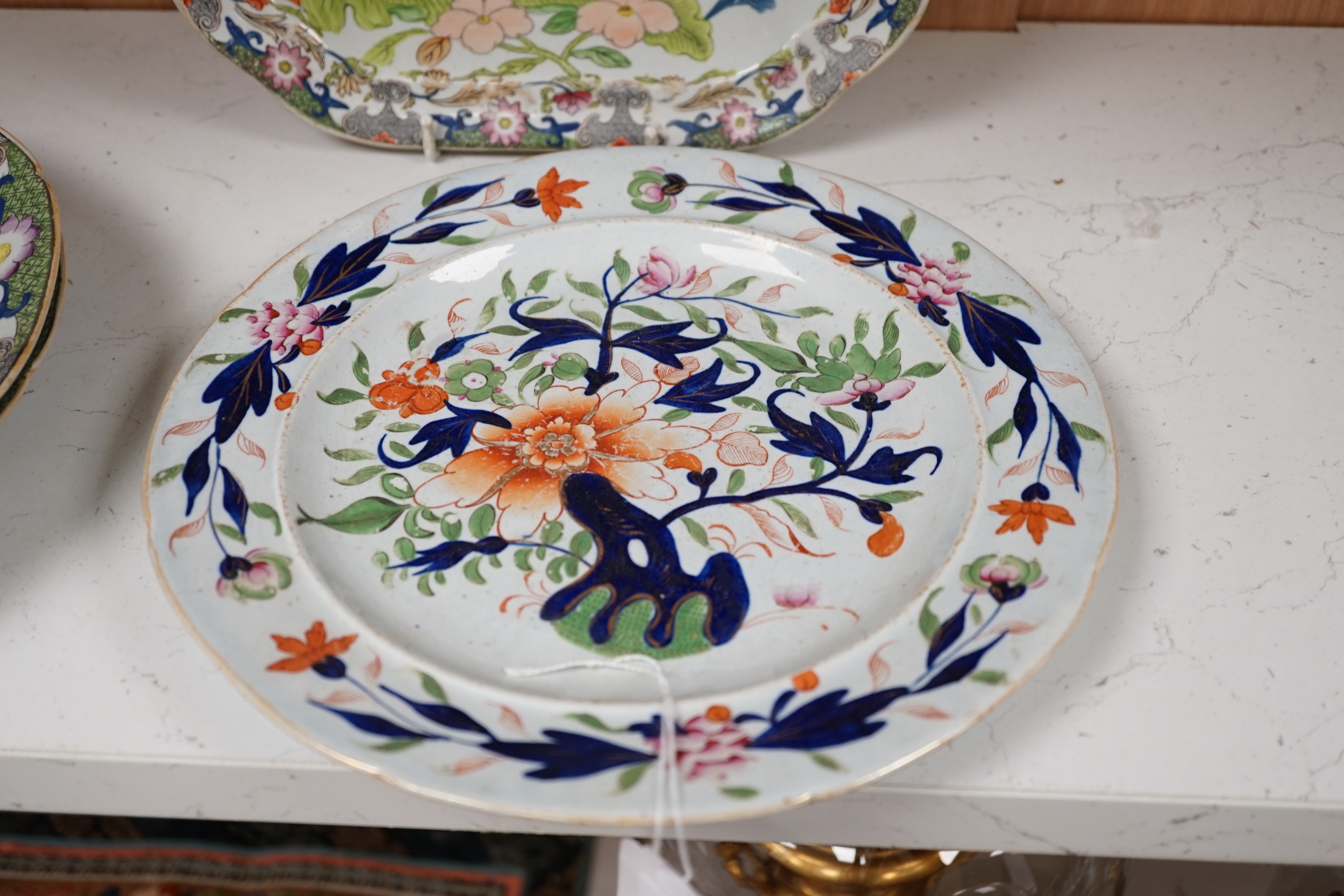 Four early 19th century ironstone dishes and a tureen together with a similar plate